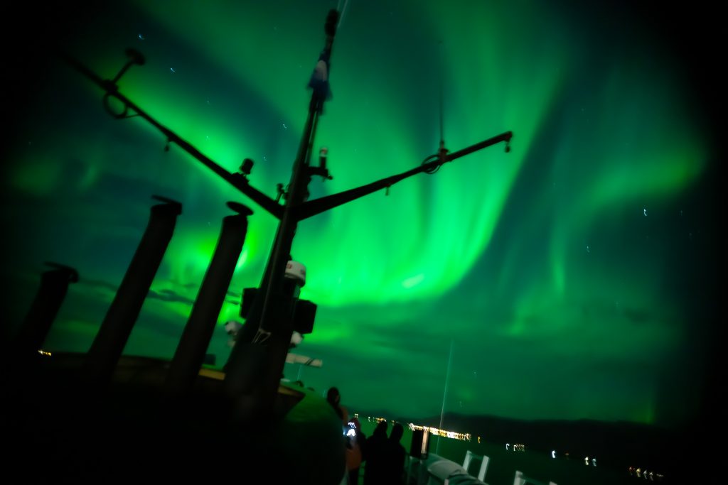 northern lights over a boat